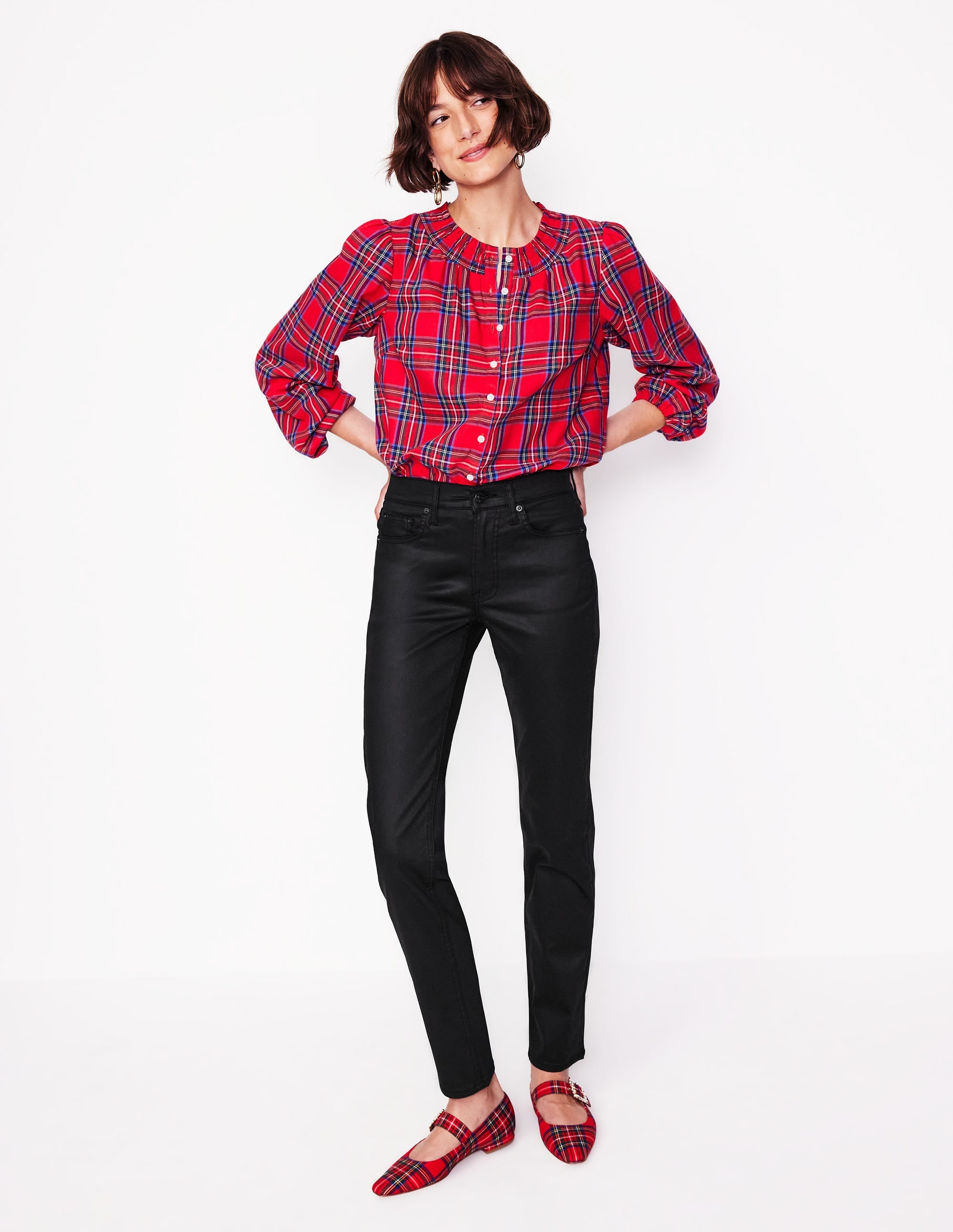 A pair of black coated girlfriend jeans with a straight-leg, ankle-length cut, mid-rise waist, and slight stretch fabric.