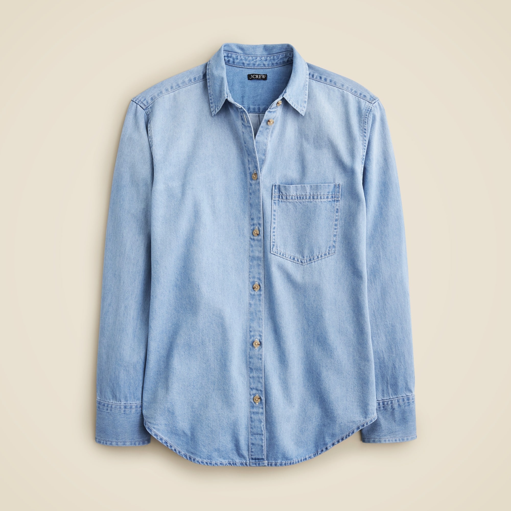 A women's chambray shirt in Storm wash with a relaxed fit, button-front, and a chest pocket, displayed against a neutral background.