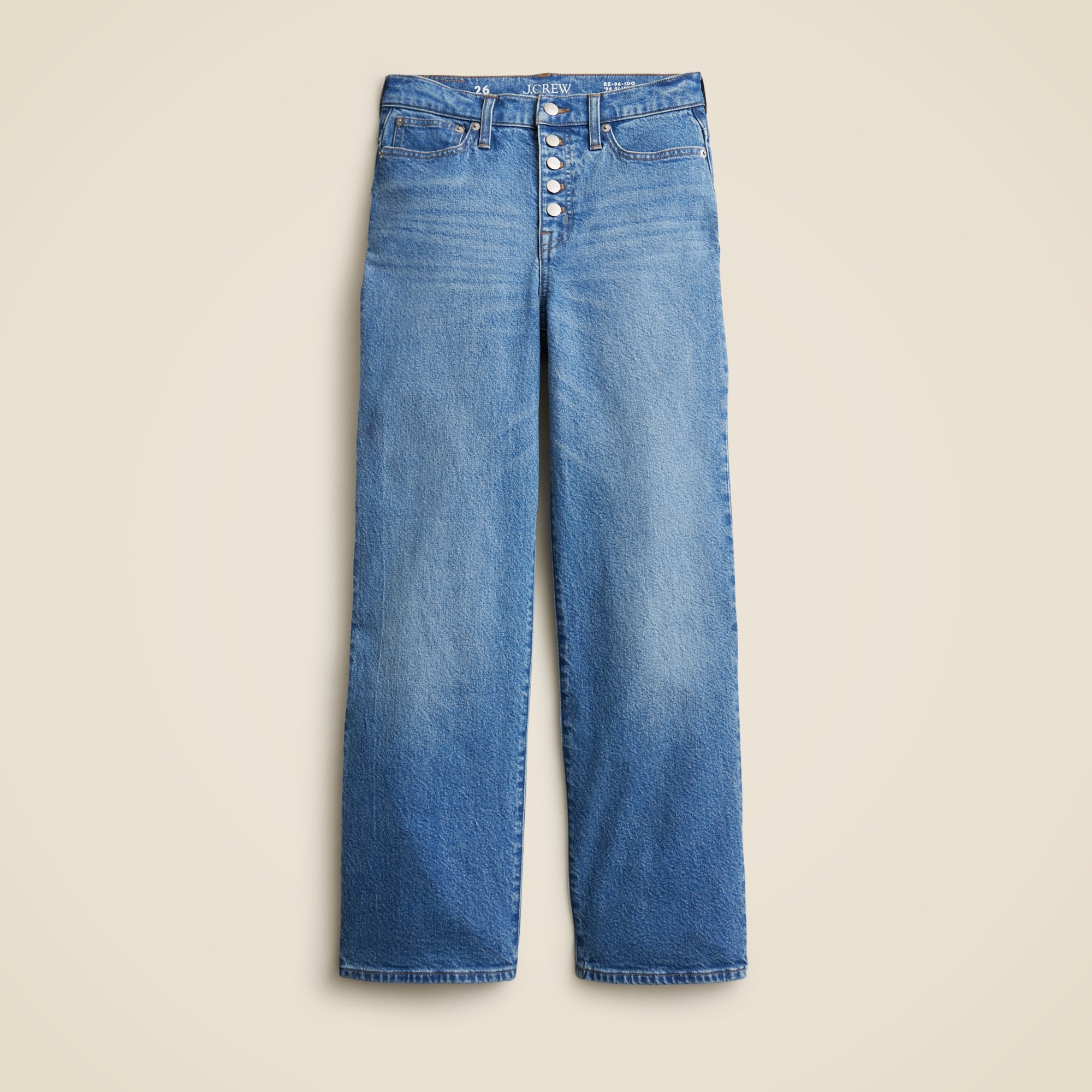 A pair of blue women's jeans with a button fly, high waist, and wide-leg cut, made from denim fabric.
