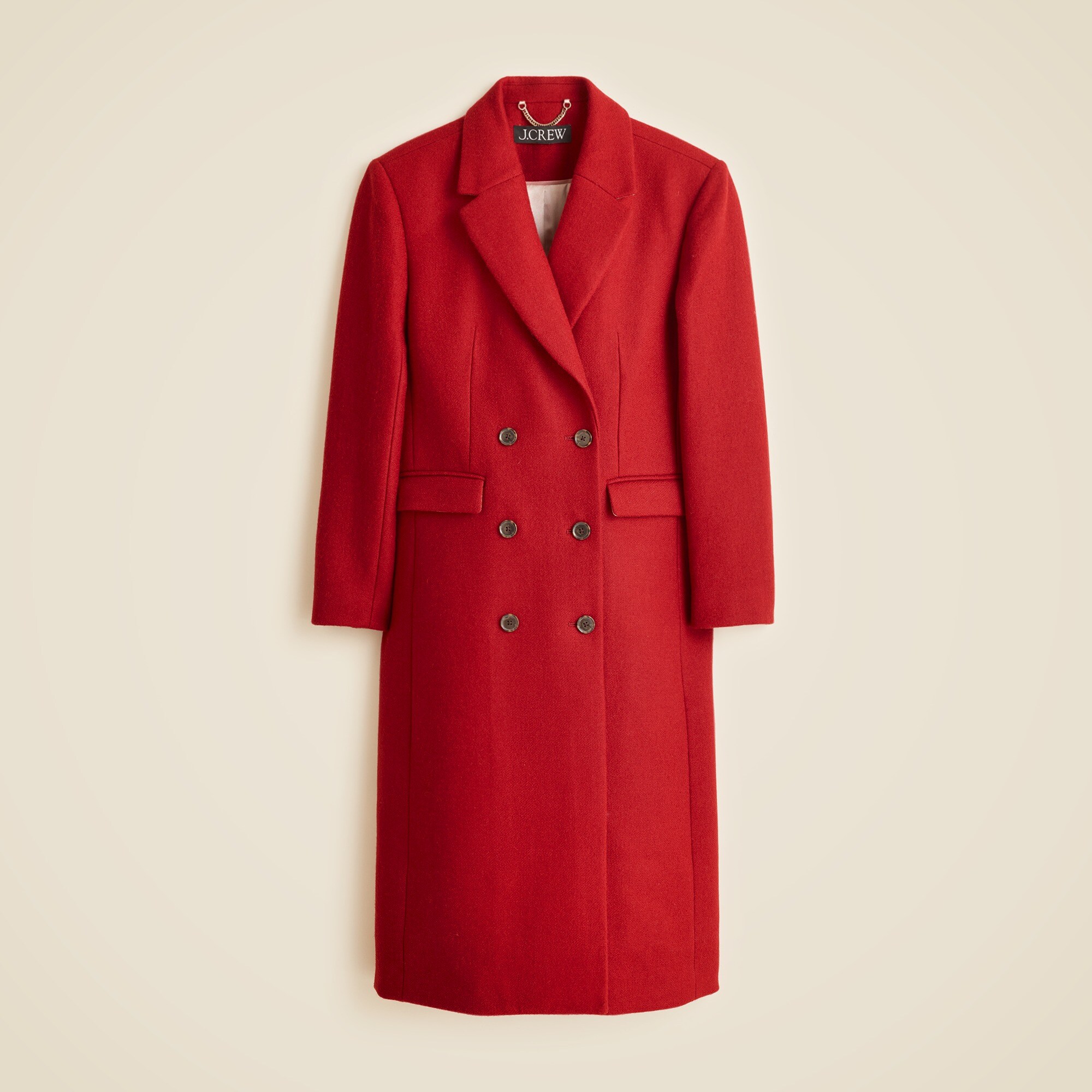 A red women's double-breasted topcoat with notch lapel, button closure, flap pockets, and a relaxed fit, made from Italian wool-blend melton fabric.
