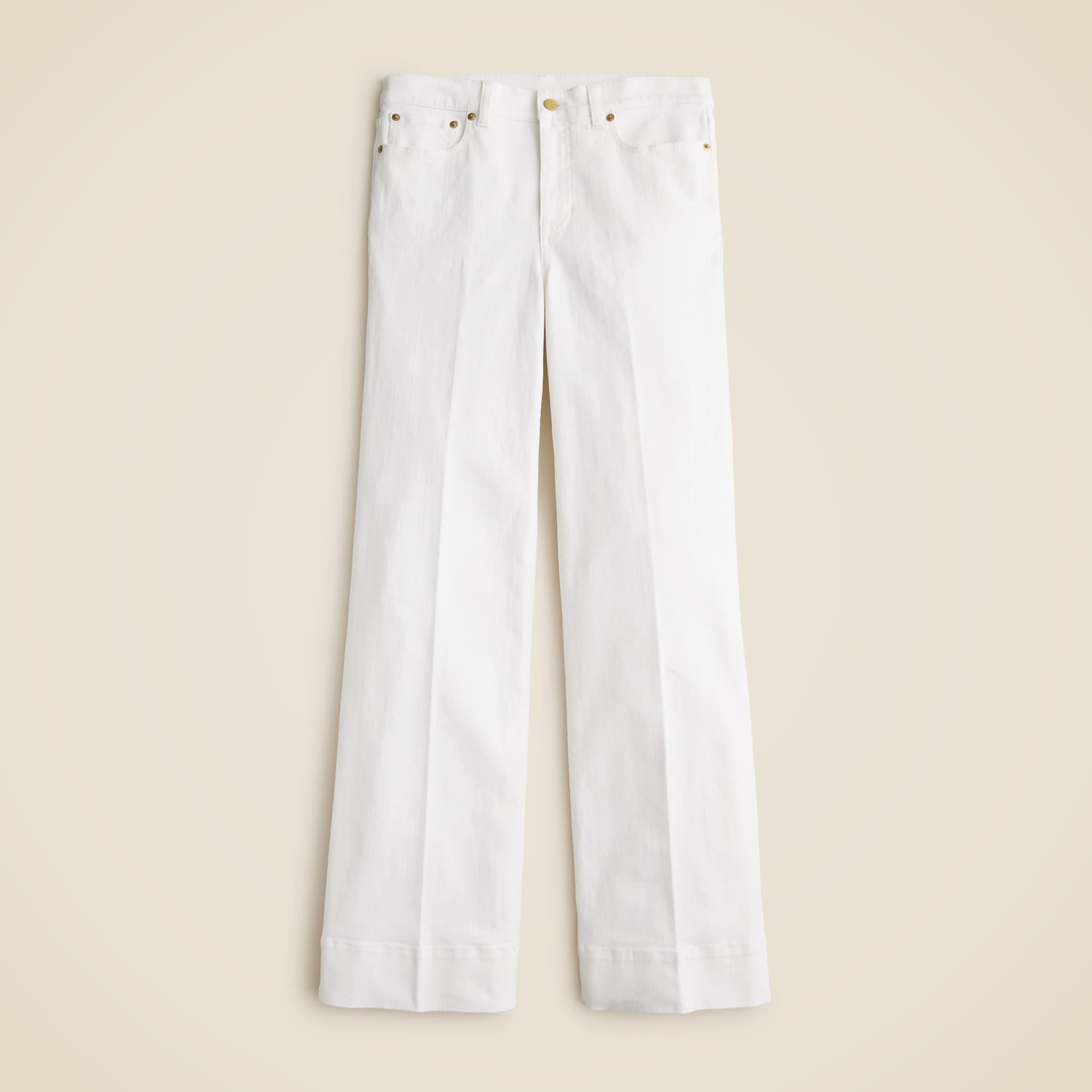 A pair of white high-rise denim trousers with a wide-leg silhouette, five pockets, and a zip fly.