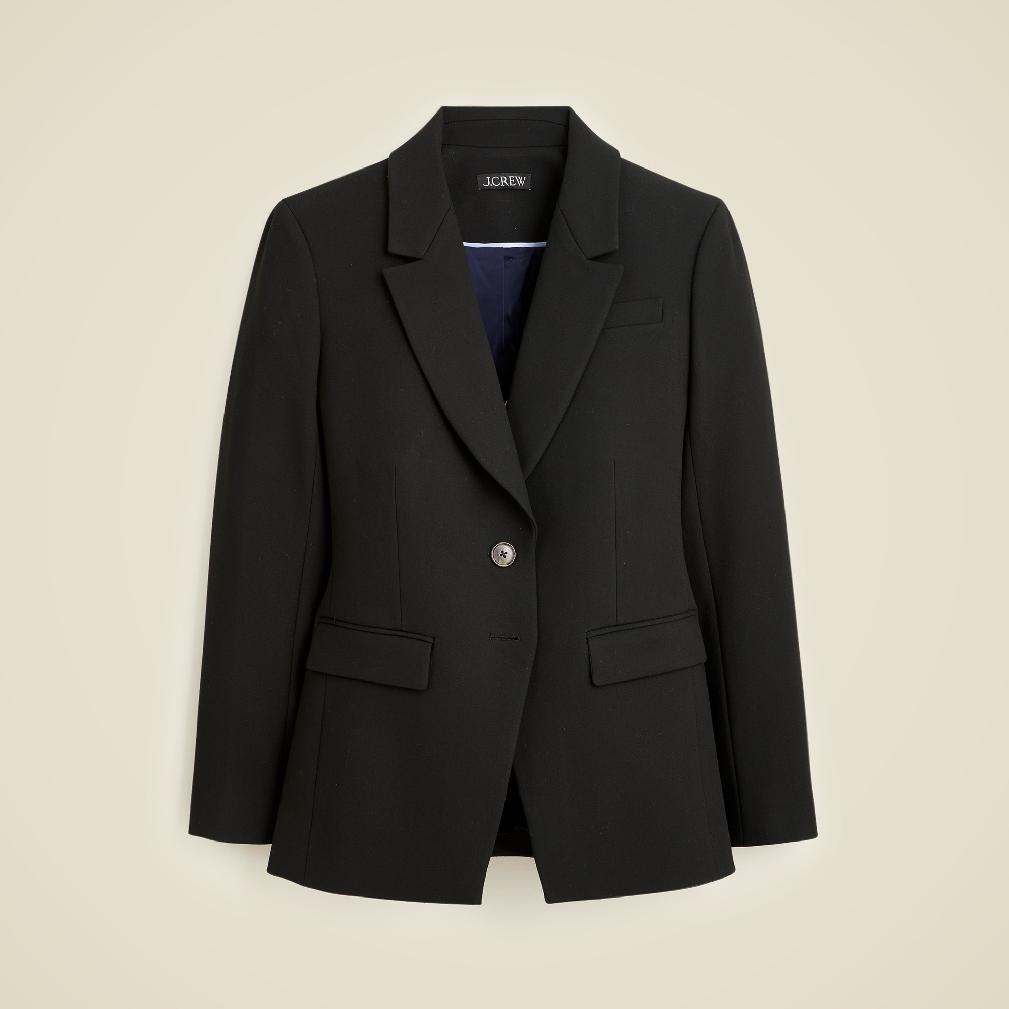 A black women's blazer with a notch lapel, welt pockets with flaps, and a single button closure, lined for a polished look.
