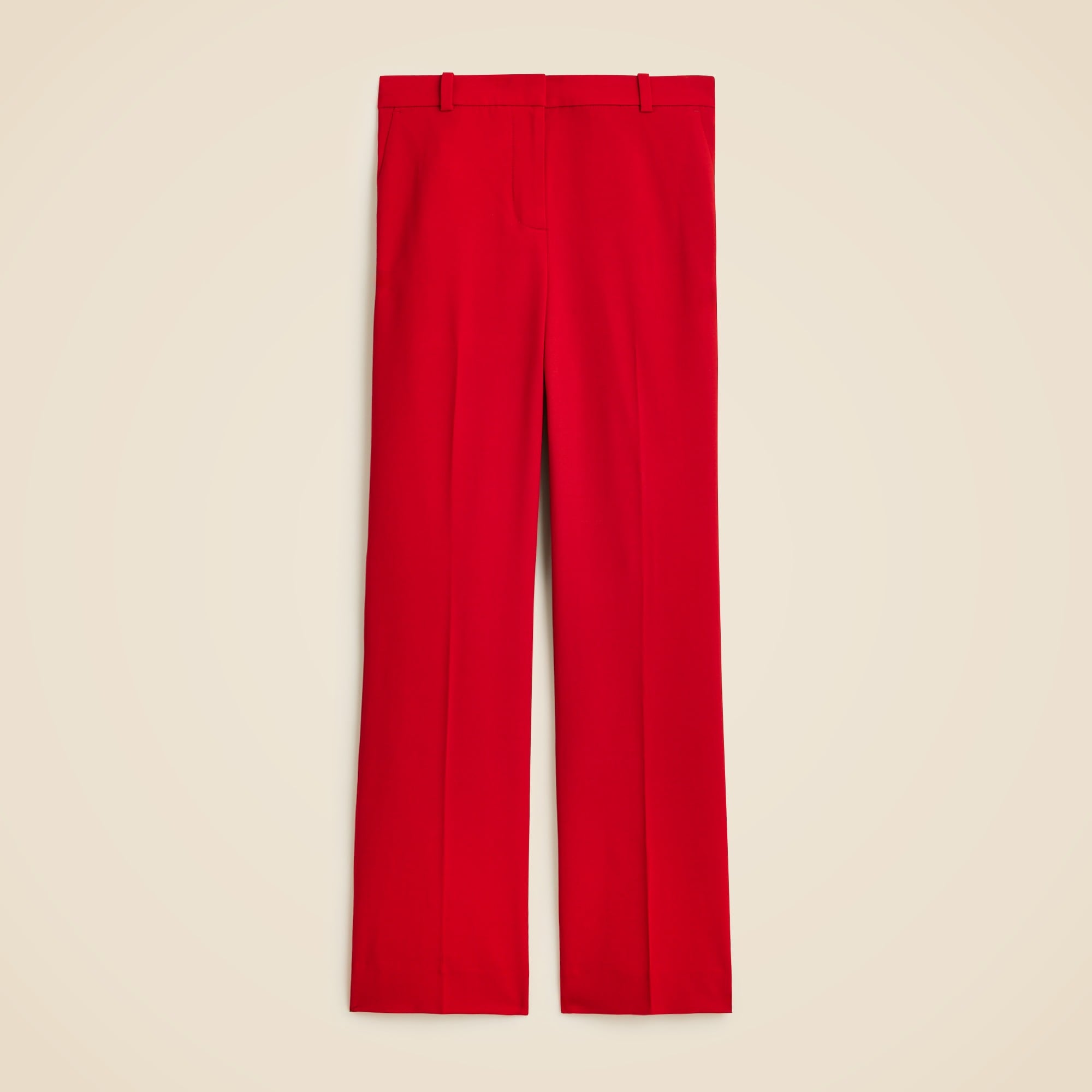 A pair of red women's trousers with a high waist, slim fit, and a slight flare at the bottom, displayed flat against a neutral background.