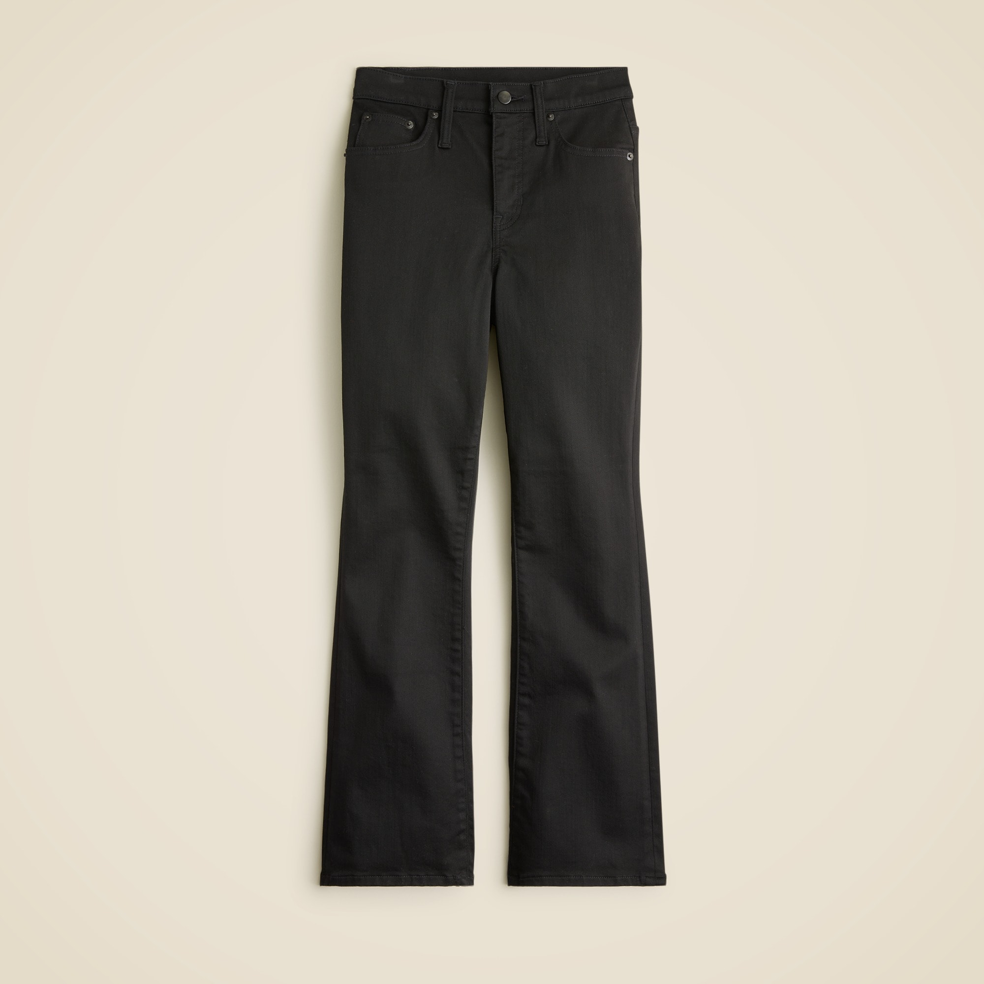 A pair of black bootcut jeans with a high waist, five pockets, and a zip fly.