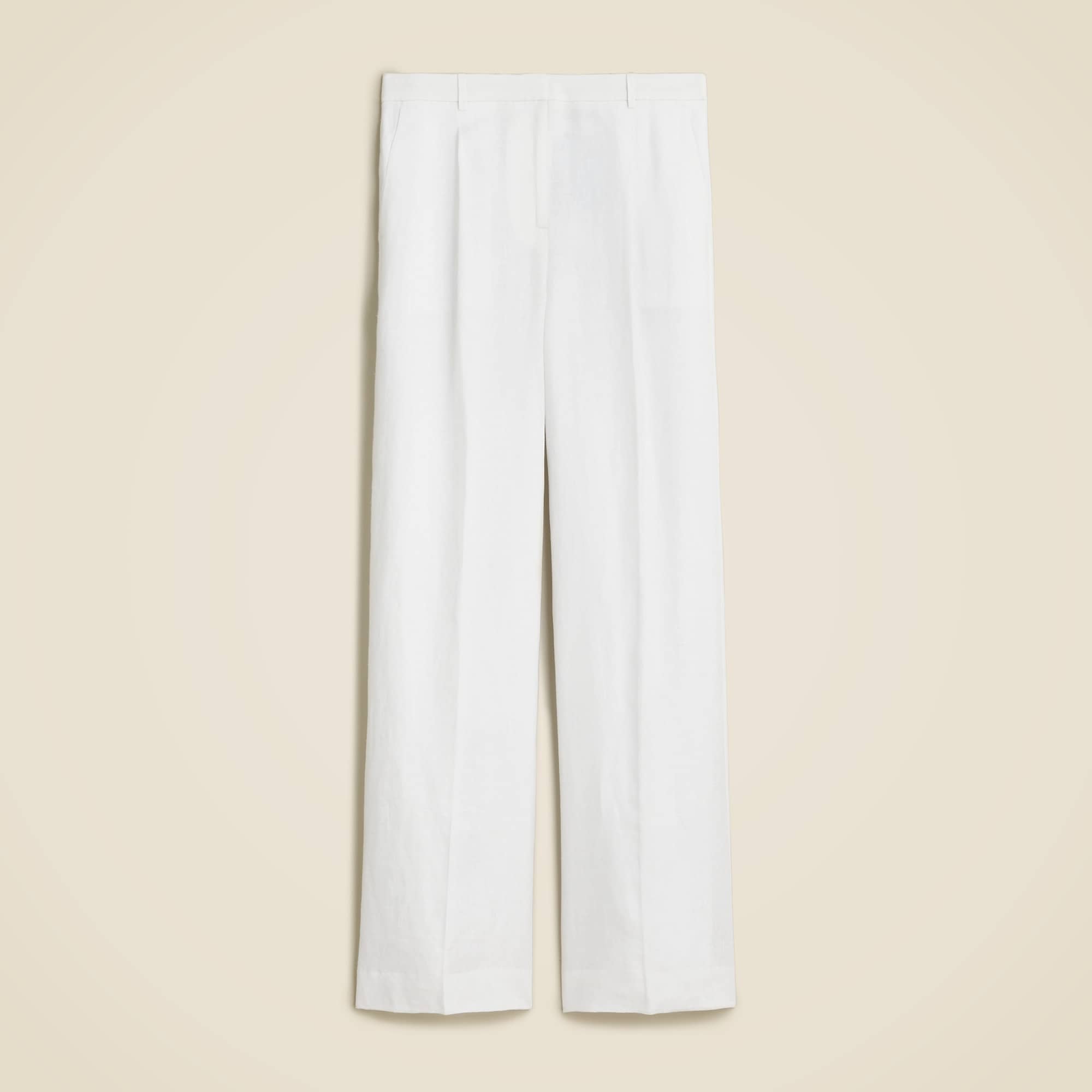 White linen wide-leg trousers with high waist and relaxed fit.