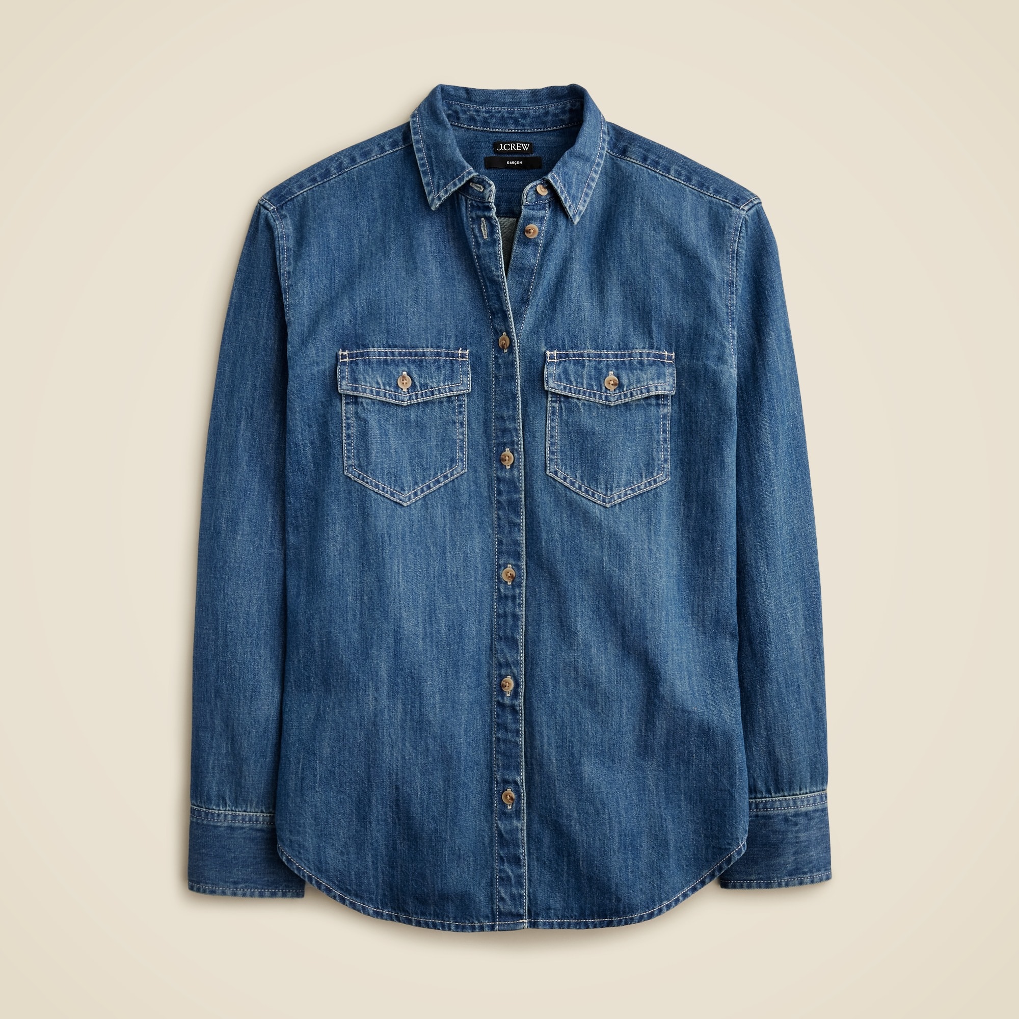 A women's chambray shirt in Neela wash with a button-down front, two chest pockets, and long sleeves.