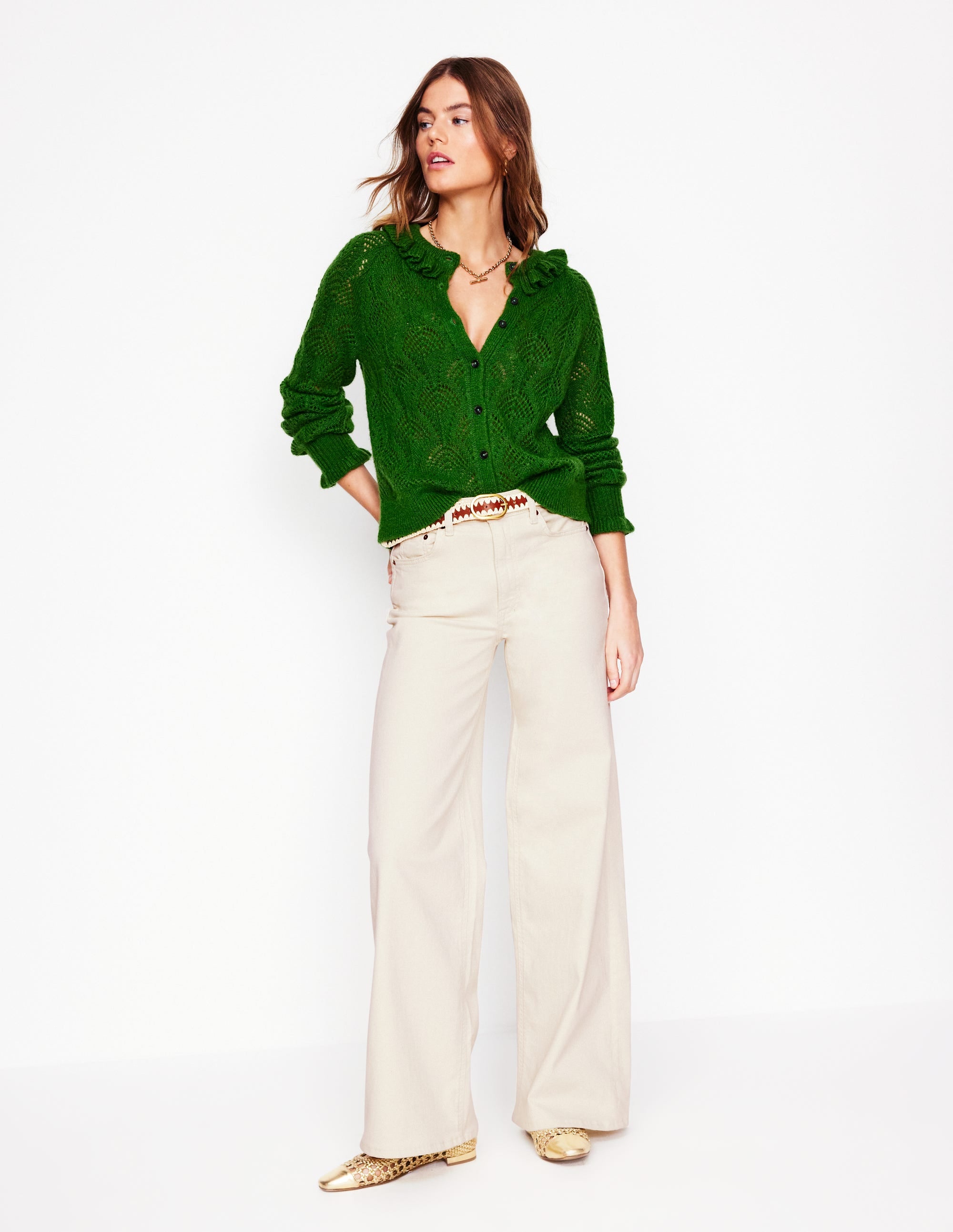 A pair of high-rise, wide-leg jeans in ecru color, with a classic five-pocket style, shown in full length.