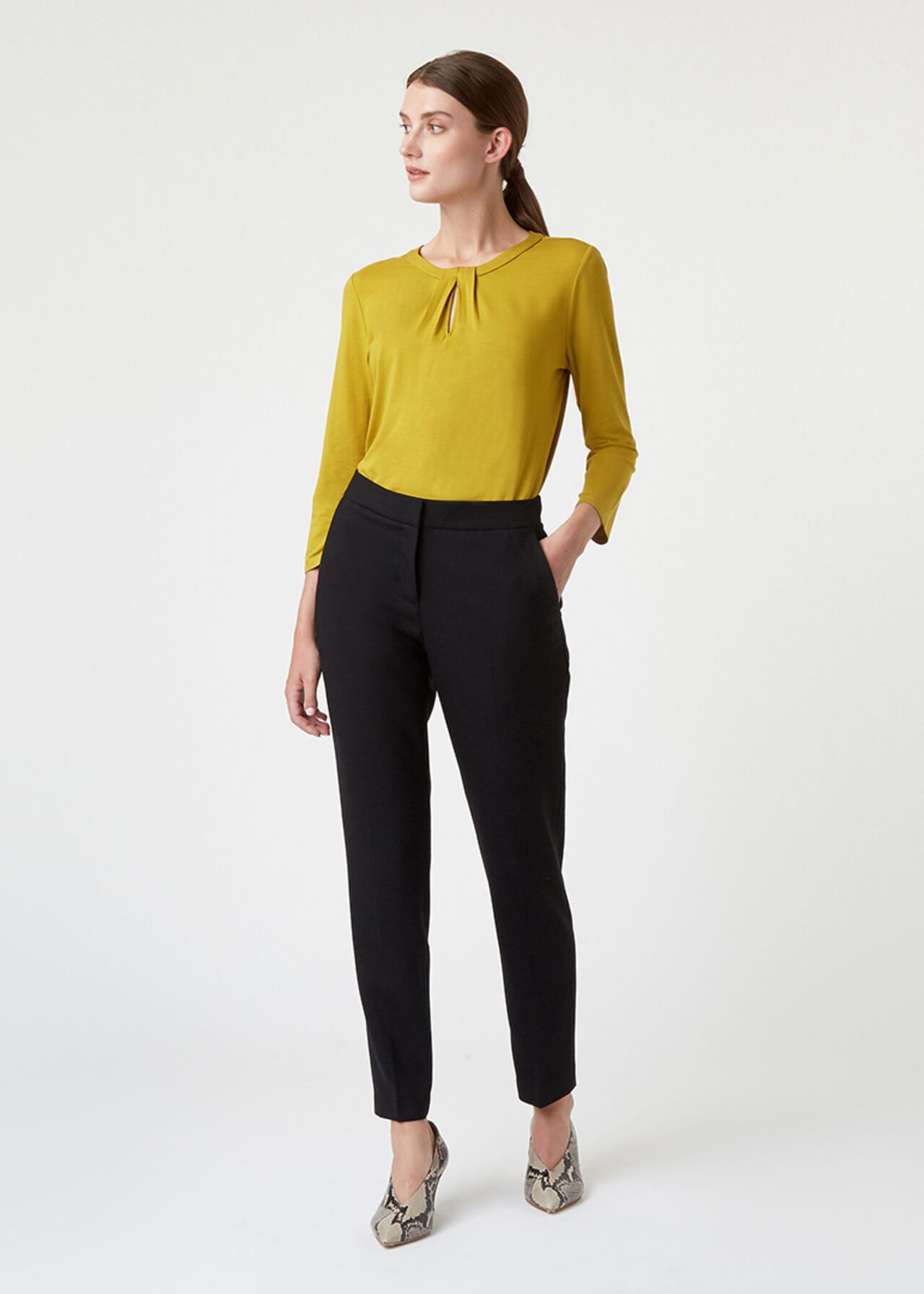 A pair of black petite wool blend trousers with a tailored fit, ankle length, and a hook and bar fastening.